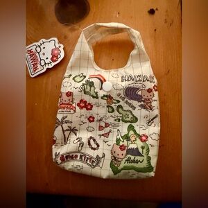 Hello Kitty Cream Bib with Green Island & Red Accents
